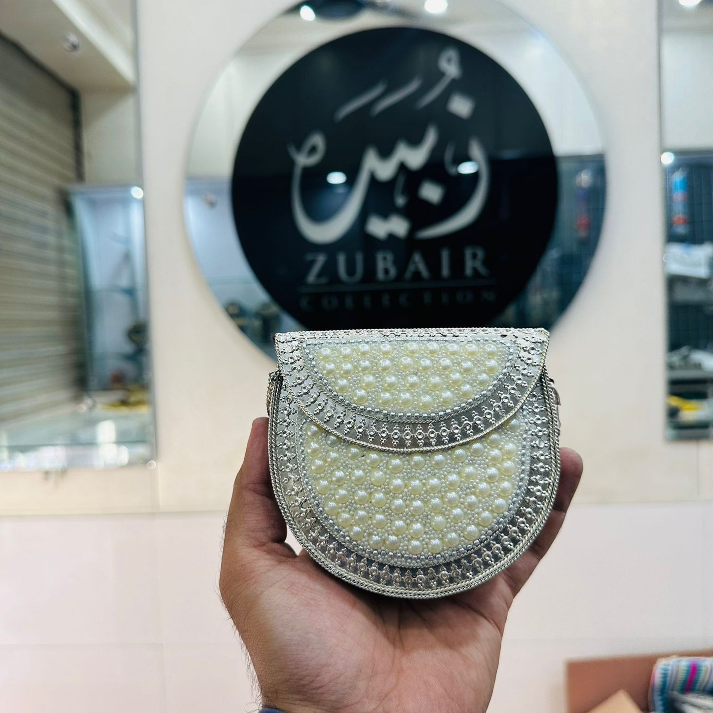 Beautiful Silver pearl clutch